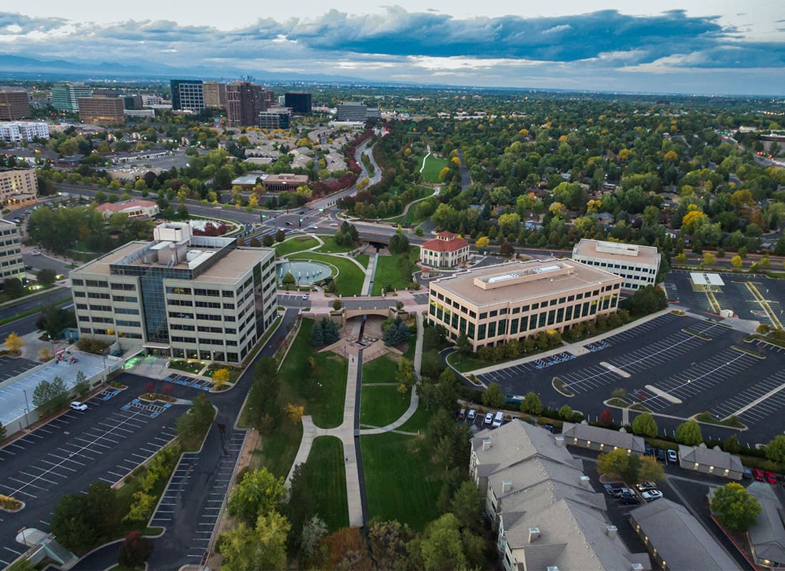 Greenwood Village, CO - Beautiful View Overlooking a Local Town and Business as the Sun Sets